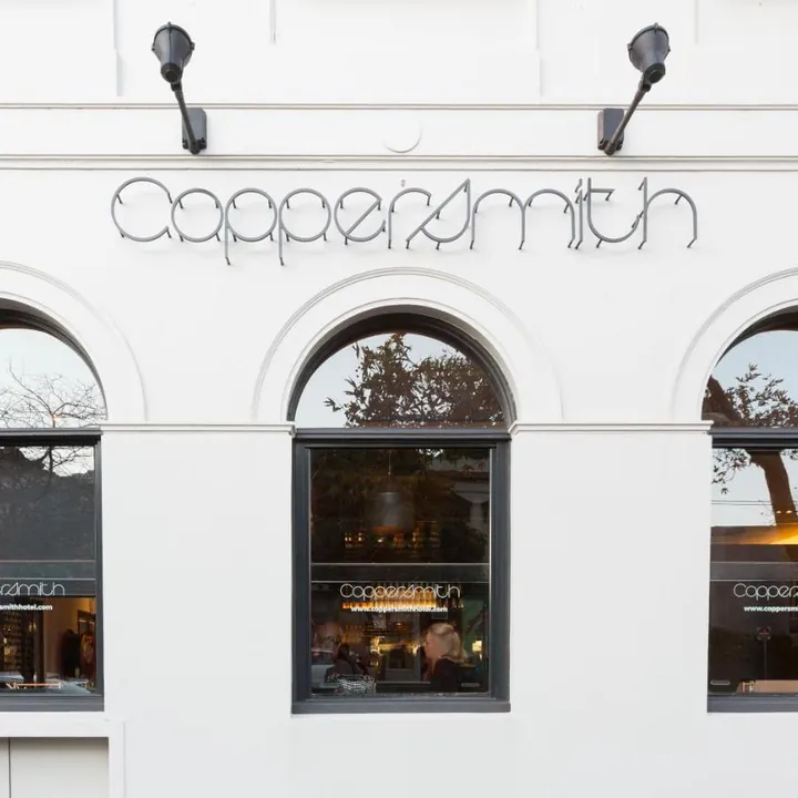 The Coppersmith's neon script above the arched windows on Clarendon Street