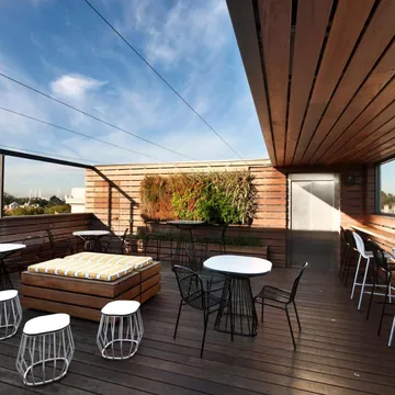 The rooftop deck with timber ceiling and open sky