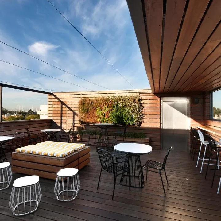 The rooftop deck with timber ceiling and open sky